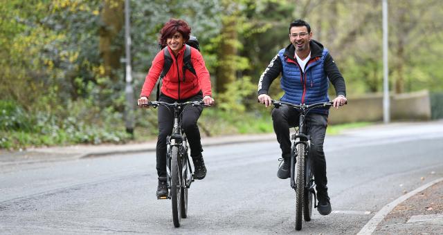 Two cyclists riding on-road