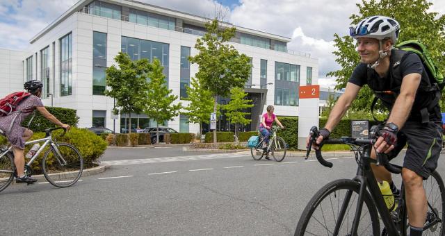 Commuters riding to work in a business park