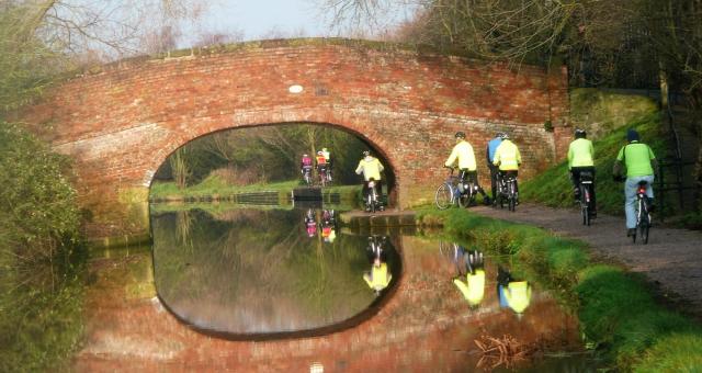 Image of Wednesday Riders on Canal Bridge