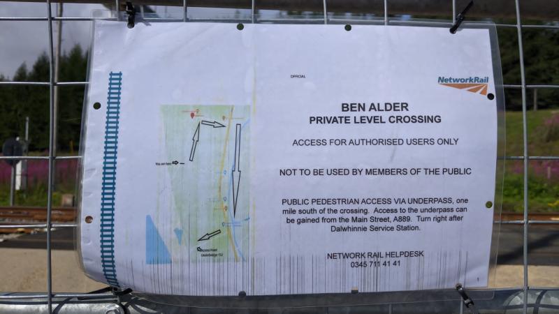 A notice attached to the gates of the level crossing stating there is no public access