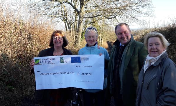 Cheque being handed over to fund the work on Little Lane