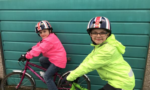 Children in waterproof cycle jackets 