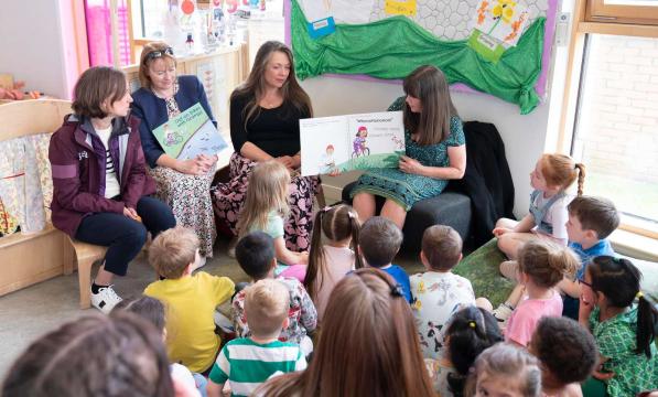 Scottish Minister for Children and Young People Clare Haughey reads a book about cycling to nursery children