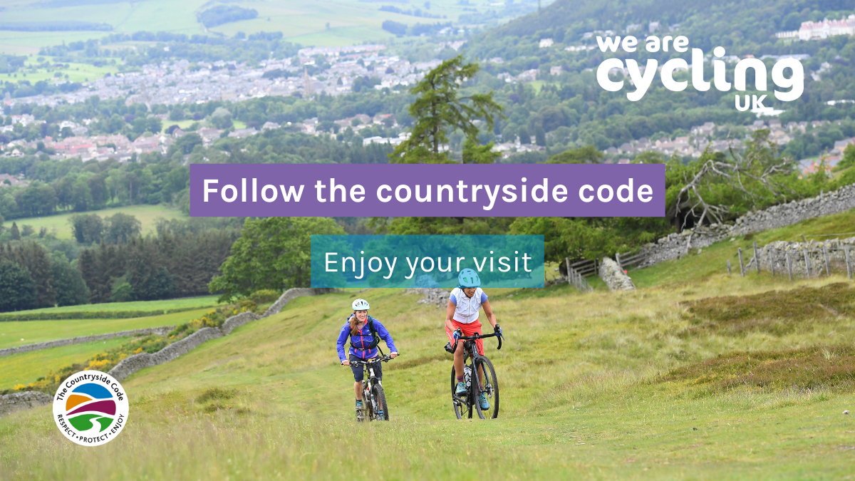 Two women riding up a grassy hill. Text overlay says "Follow the Countryside Code, enjoy your visit"