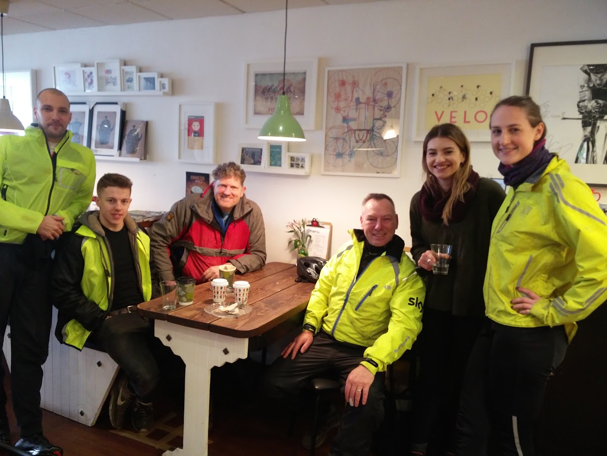 Steve (in red) mets with H3 volunteers