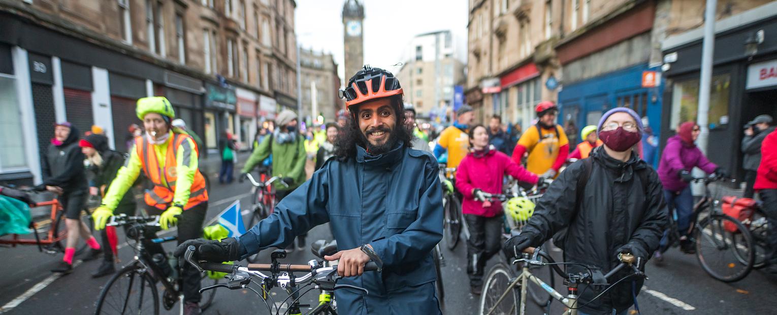 People pushing bikes at a protest march