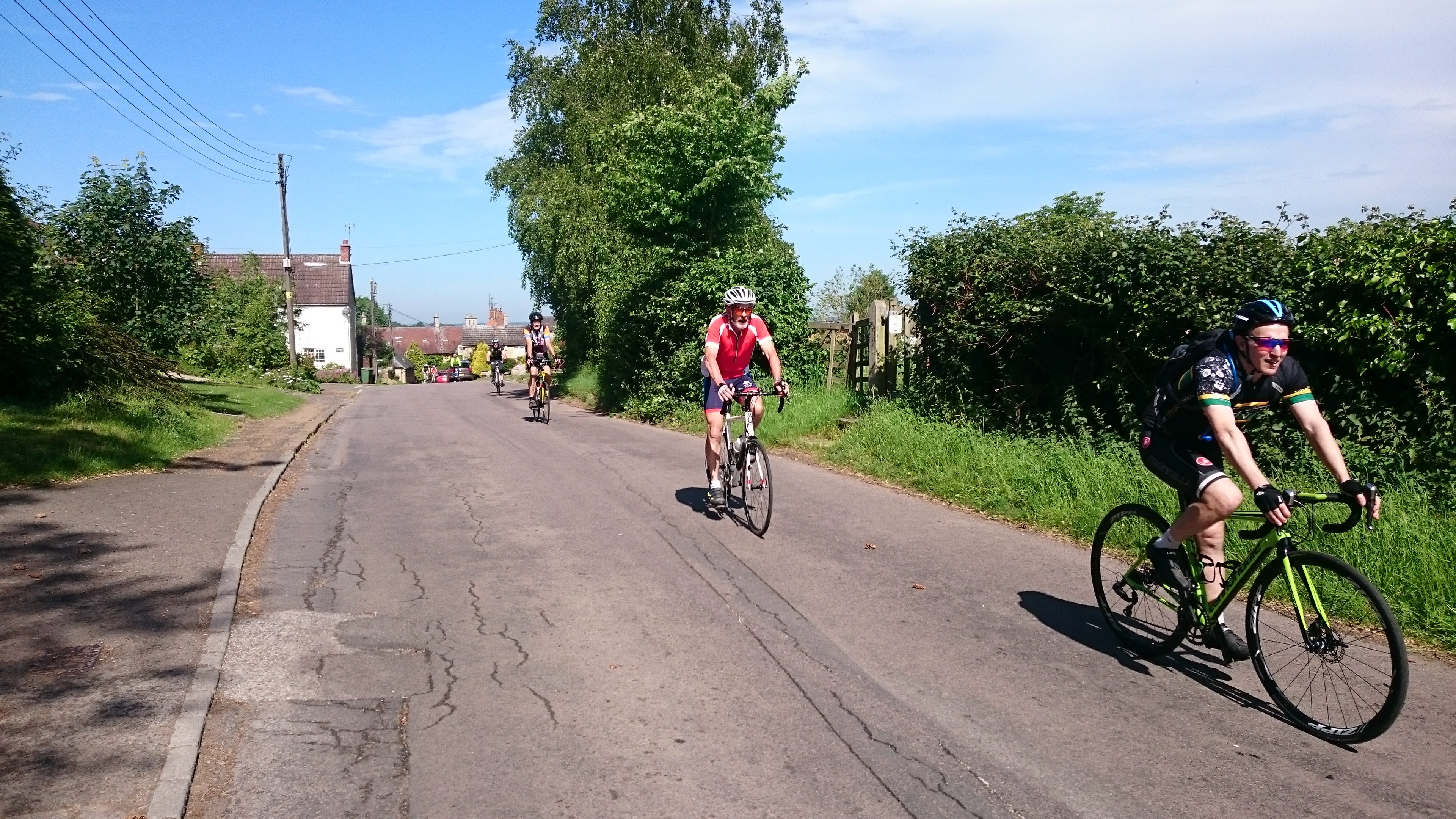 Three cyclists on club ride through Felmersham in Greast Ouse valley