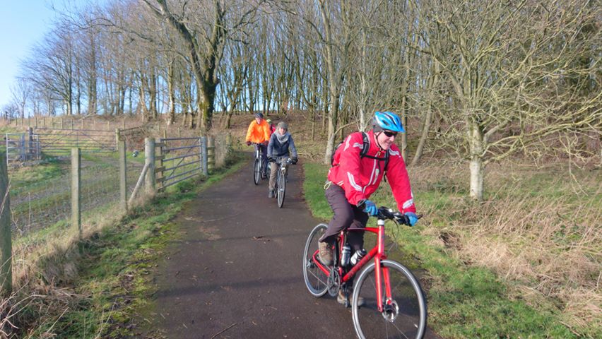 Cyclists enjoying a downhill on the traffic free Maiden Bower path.