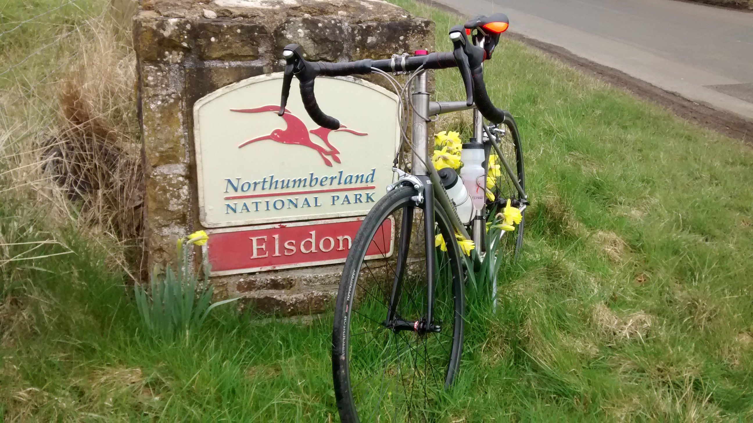 Bike next to Northumberland National Park sign