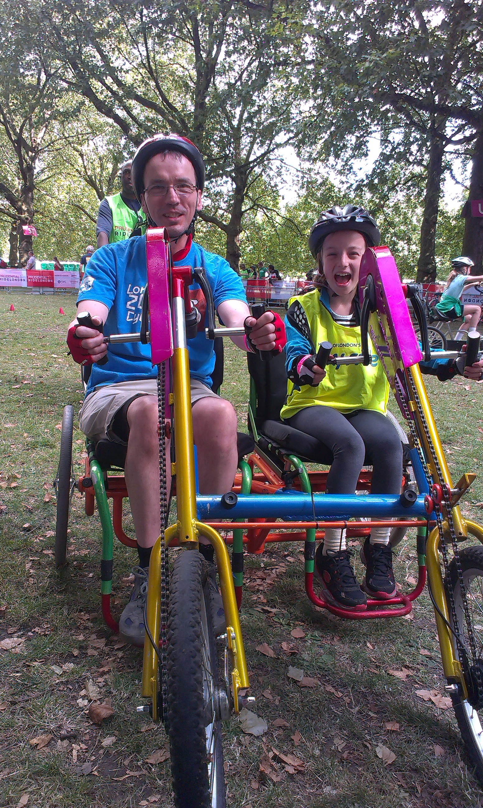 Father and daughter on a hand double bike