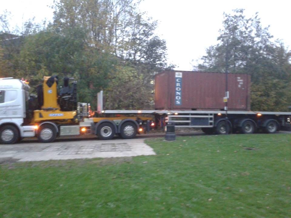 The new container being transported to site