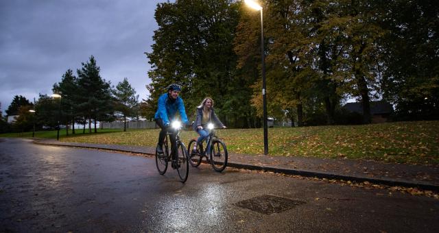 Cyclists riding at night