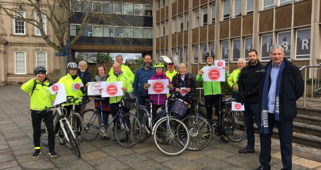 Residents gather outside the Shire Hall to show their support for cycling