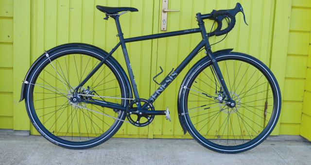 Genesis Day One 10, a singlespeed bike with mudguards, drop bar and bottle cage