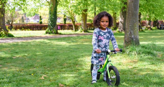 A toddler on a Islabikes Rothan balance bike. Photo by Julie Skelton for Cycling UK