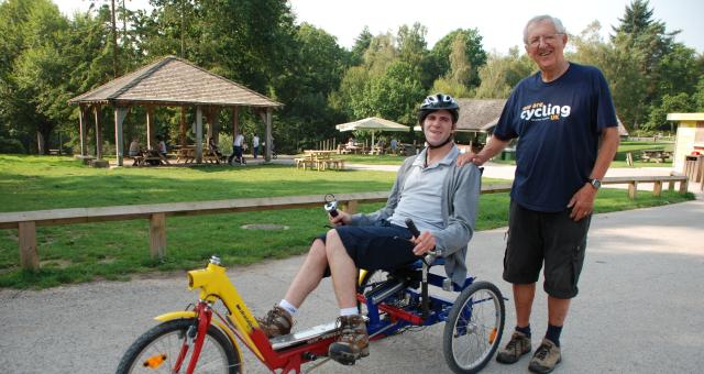 Recumbent rider with volunteer