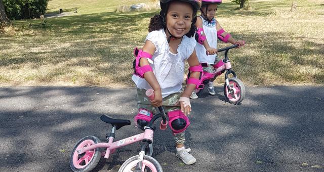 Christina's twin daughters, Esmee and Desiree, on their balance bikes