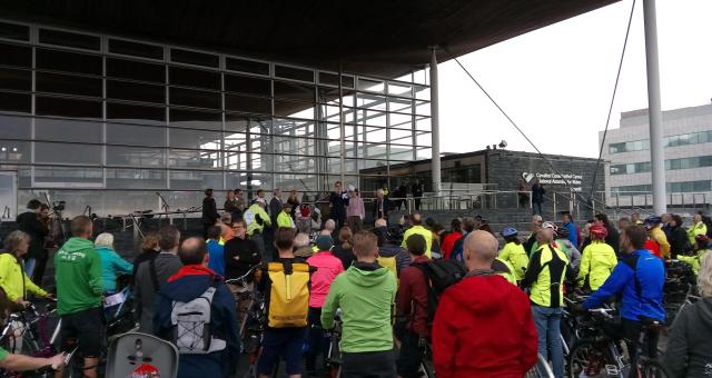 Cyclists gather on the steps of the Senedd