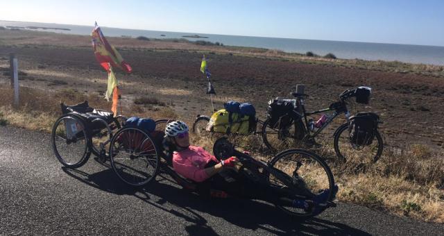 Karen Darke on her handcycle alongside the Murray River