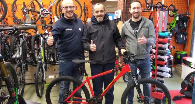Steven collects the 100th bike provided by WheelNess
