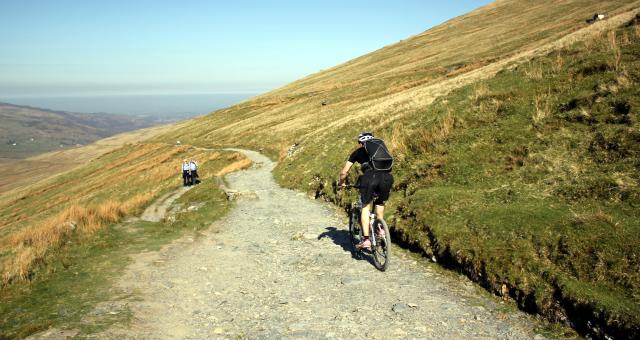 Mountain biker riding down Llanberis Path on Snowdon