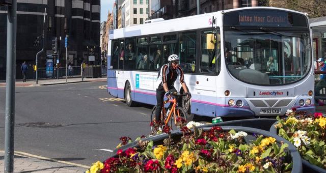 Cyclist and bus