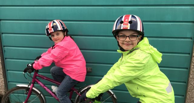 Children in waterproof cycle jackets