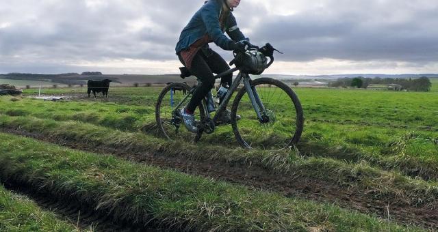 Woman riding in a field
