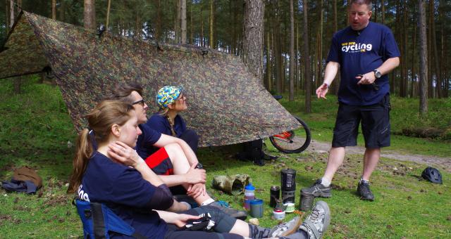 A course leader carrying out some training in the forest