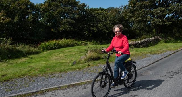 woman cycling in rural area