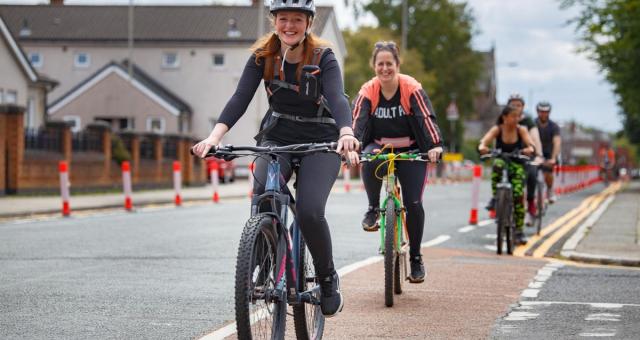 women cycling in urban area