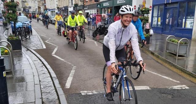 A mass cycle ride through Wells city centre, Somerset