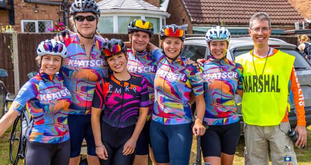 Elle stands with her teammates and one of the organisers at Seacroft Wheelers Road Race. She is fifth from the left, third from the right. She is wearing Klatsch club cycle kit.