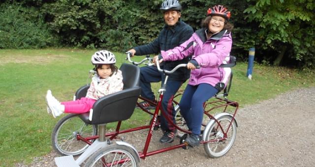 Sophia and her family on an adapted cycle