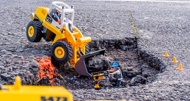 Playmobil digger in a pothole