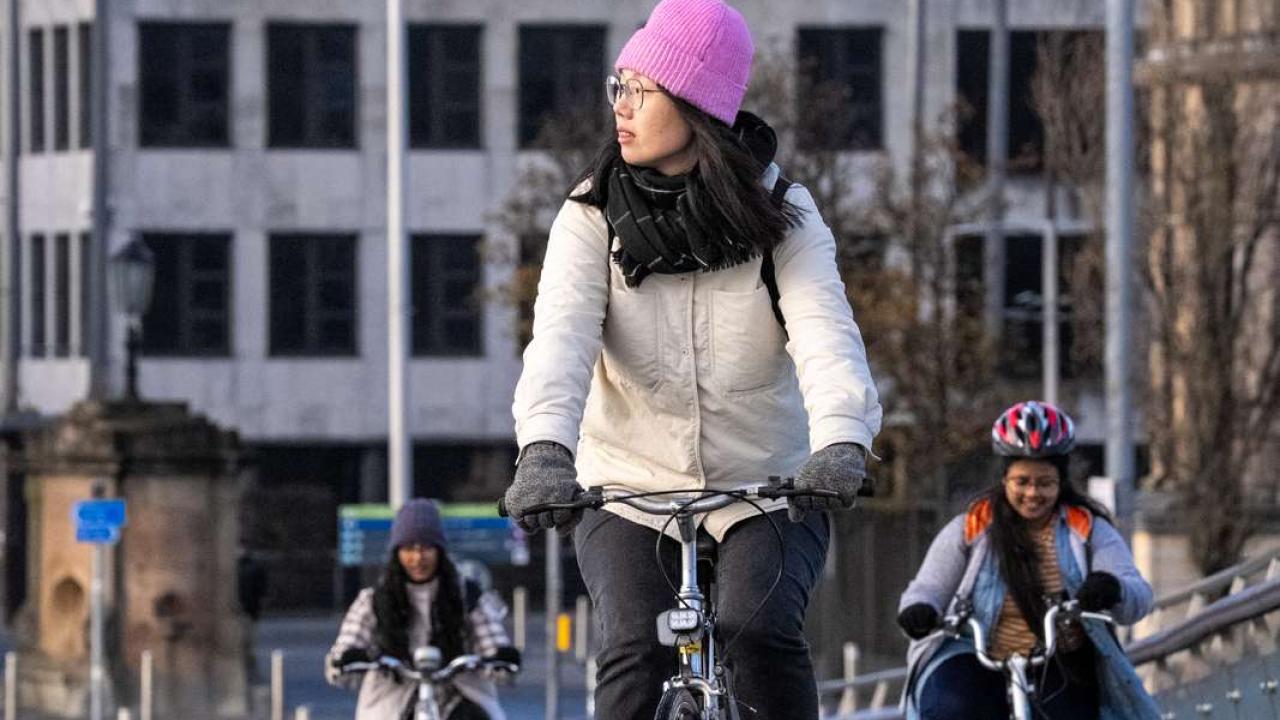 Woman in city riding bike