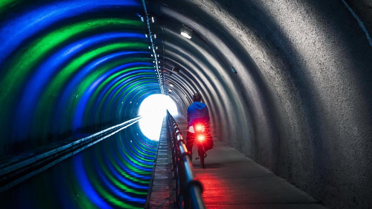 Lighted cyclist in a tunnel