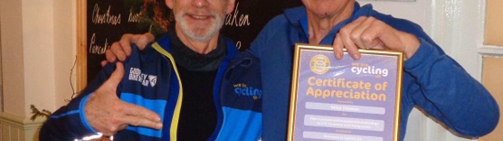 Former Chair of Cycling UK presents volunteer Mike Thomas with a Certificate of Appreciation. Photo by Coventry CTC