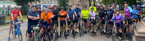 Group of cyclists posing together as they take part in the London to Amsterdam cycle challenge