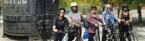 Group of women standing together with their bikes