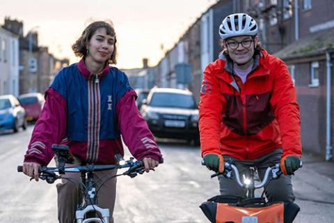 Family cycling together