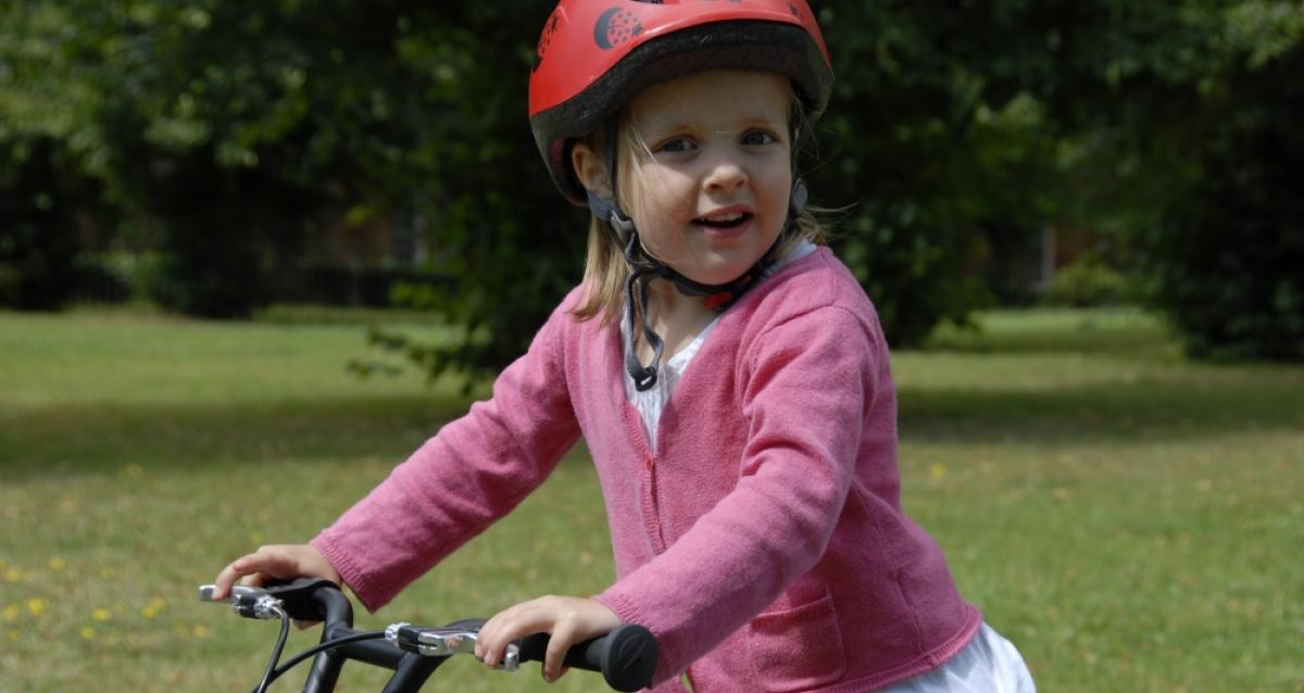 Cycling on pavement with child 2025