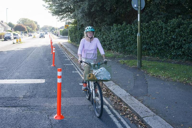 Woman cycling in temporary cycle lane