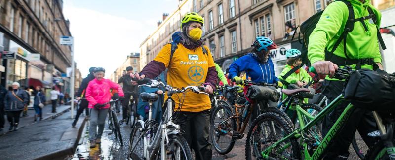 Climate campaigners pushing bicycles