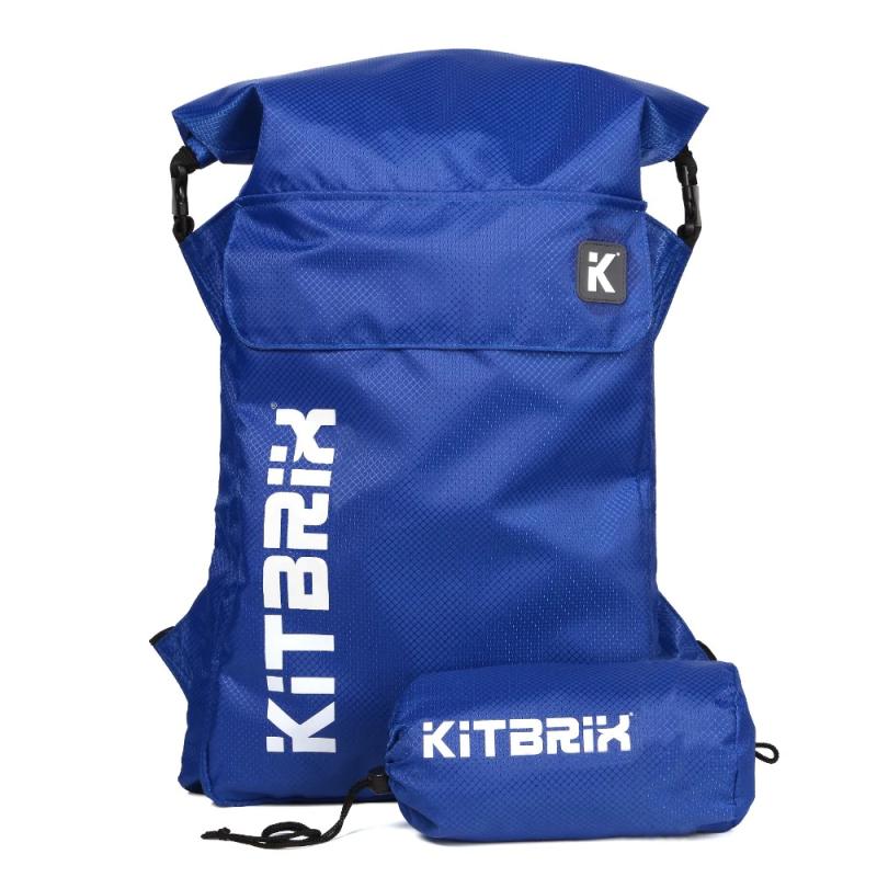 A blue rucksack with the KitBrix logo in white and the carry bag it folds down into