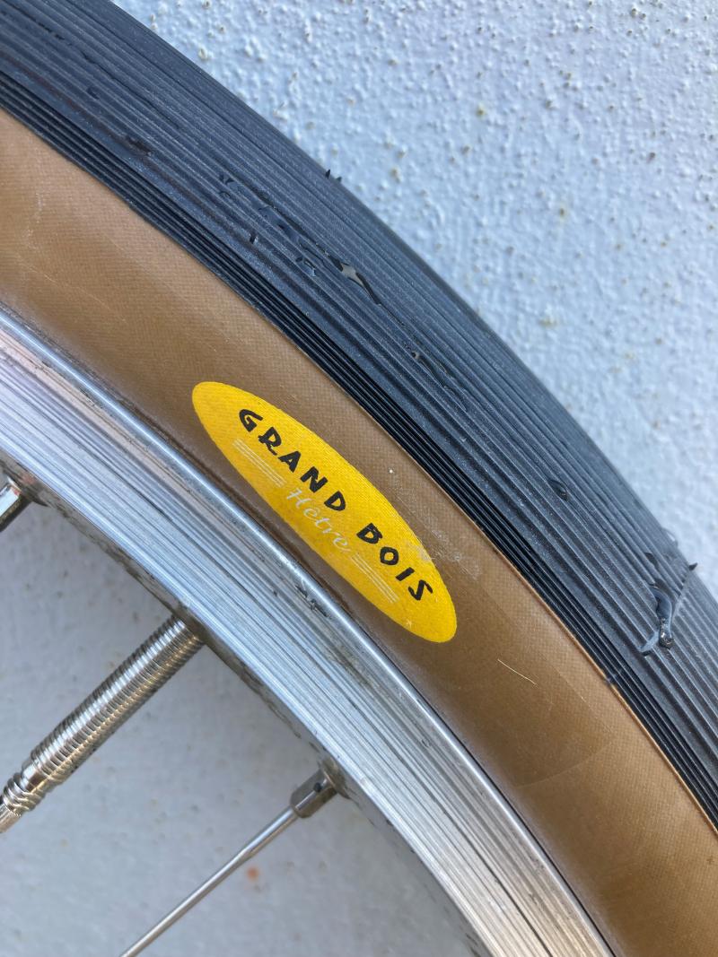 A close-up of a Grand Bois bicycle tyre on a wheel