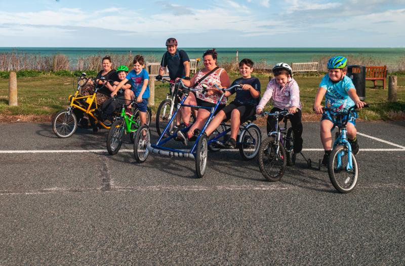 Children and adults on a variety of cycle types
