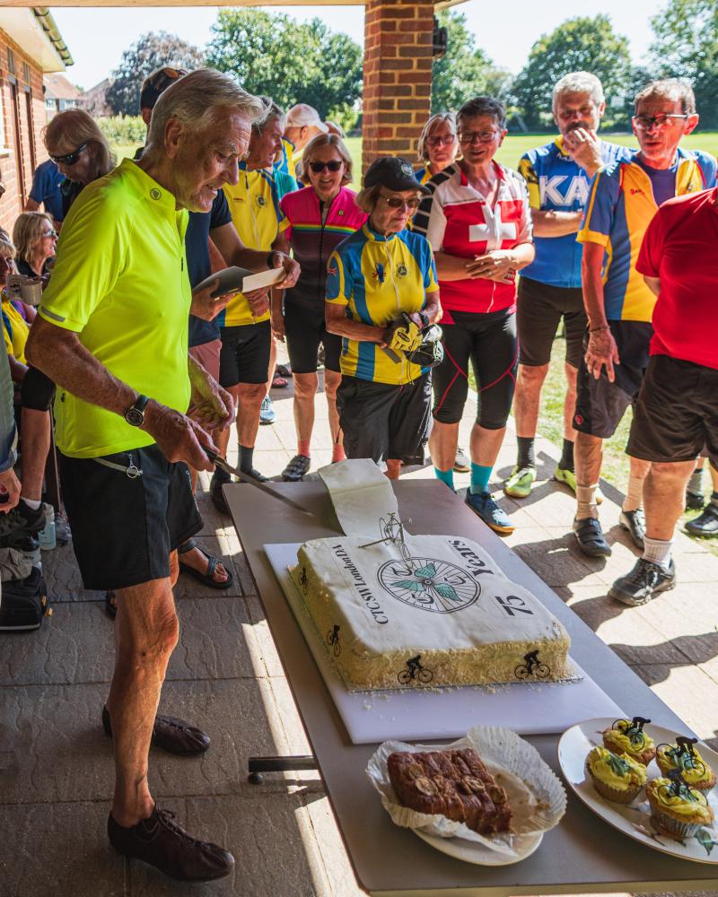 Colin Quemby cutting the anniversary cake