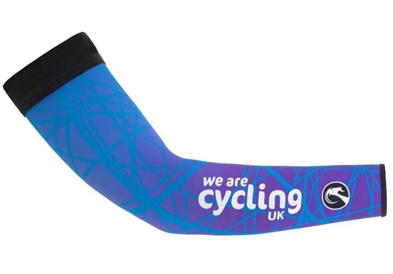 A blue and purple patterned arm warmer with the Cycling UK and Stolen Goat logos