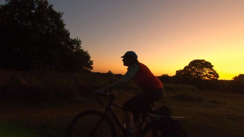 Cyclist heading off into the dusk